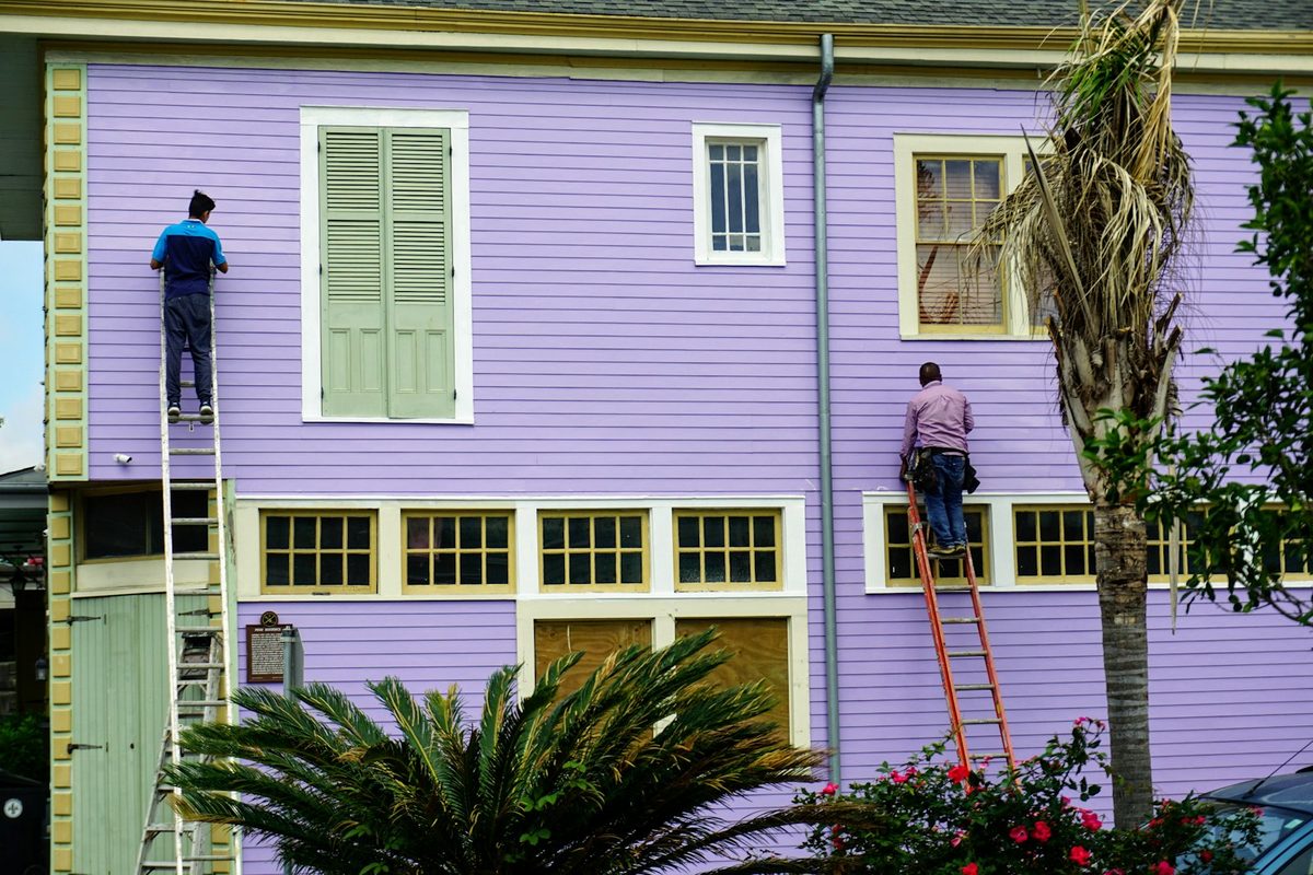 Painter working on a building exterior