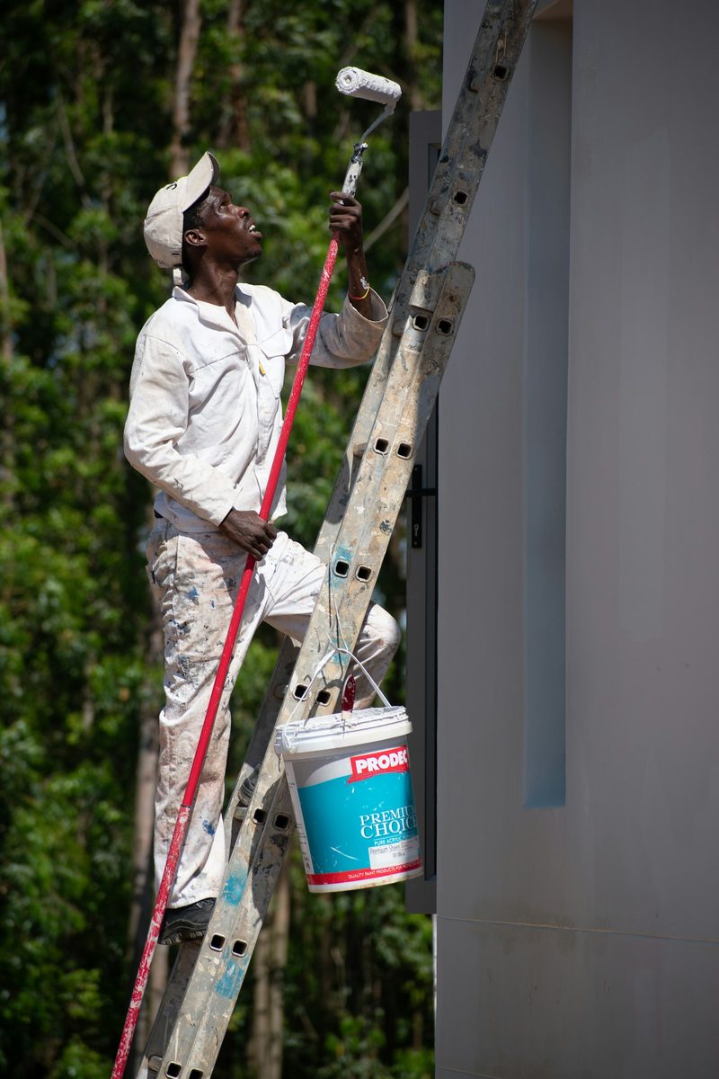 Painter at work on an interior wall
